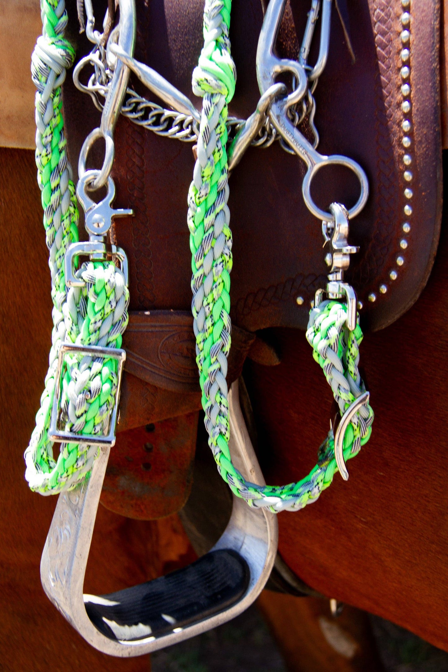 Braided reins, neon green and silver, close-up detail