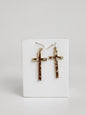 "Holy Cowhide" cow print cross dangle earrings
