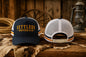 Navy blue Settlers Western & Co snapback trucker cap, golden embroidered wordmark