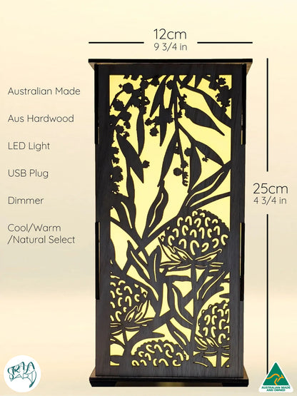 Australian hardwood lamp, Australian Flowers design, on side table