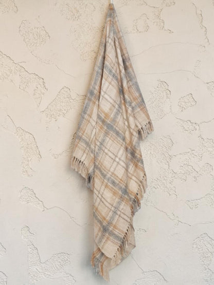 "Dusty Plains" woven throw blanket in dusty pink, hanging display, country home decor
