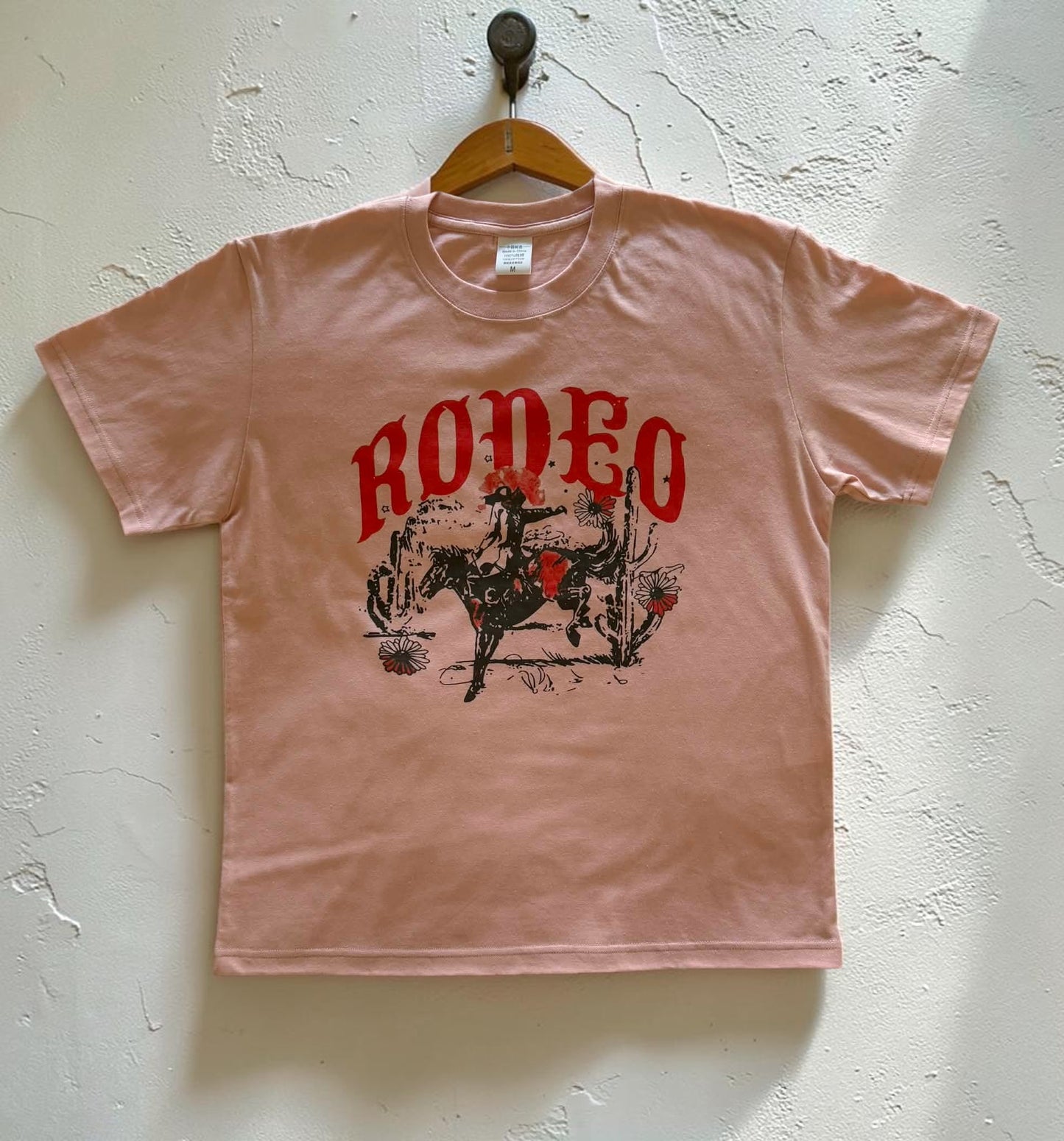 Desert Rodeo country graphic tee, pink, front print